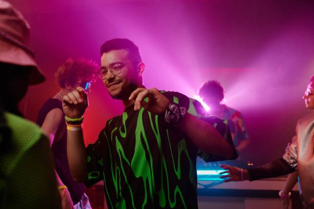 istock Dancing in club with friends and deejay 2166328506