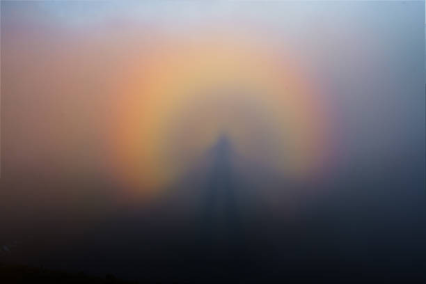 istock Brocken spectrum formed on a mountain summit among fog 2166328571