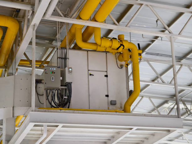 istock Ceiling with ventilation pipes and lights in industrial building 2166329527