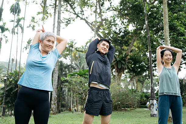 istock Group of sporty Asian strecthing their arm before jogging 2166329654
