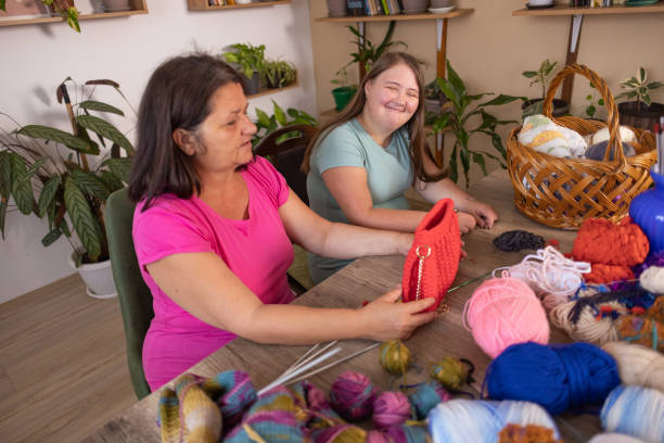 istock Mother and Daughter Knitting Together 2166331831