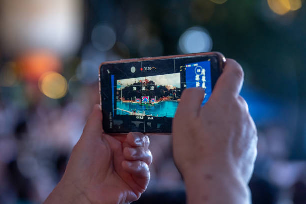 istock person photography with mobile phone at night 2166334183