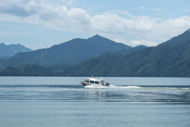 istock tourist yacht sailing on lake 2166334297