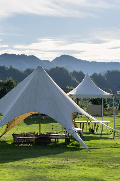 istock camp tent in meadow 2166334635