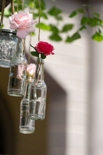 istock bottles with flower hanging on line 2166334944