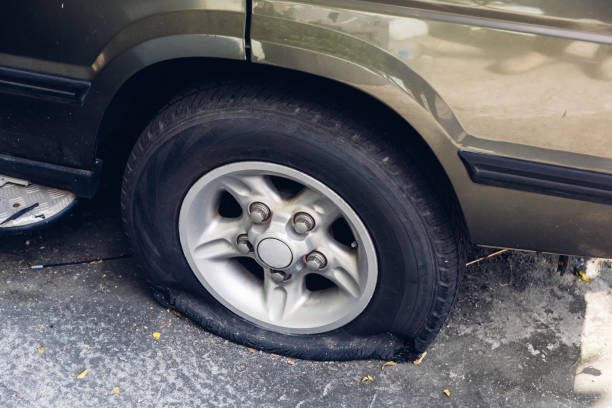 istock Destroyed blown out tire with exploded, shredded and damaged tire on a modern automobile. 2166336745