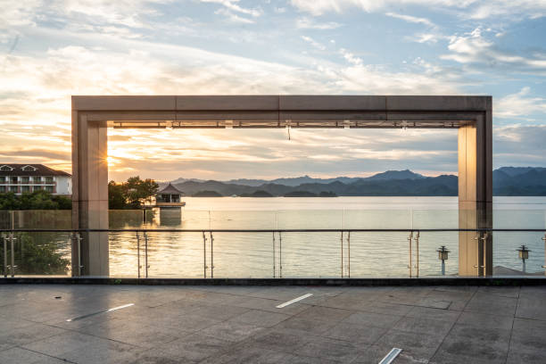 istock wooden structure by lake at sunset 2166337830