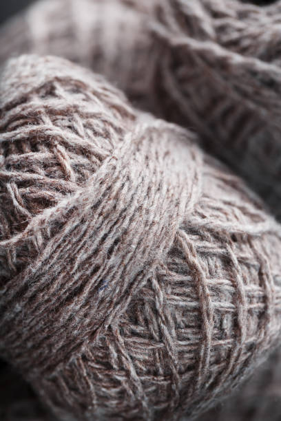 istock Light brown wool yarn made of threads in tangles. 2166338926