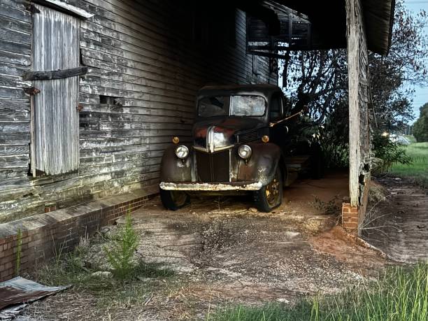 istock Old truck and barn 2166340350