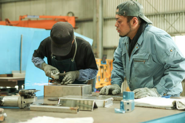 istock Senior industrial worker and worker receiving education 2166342482