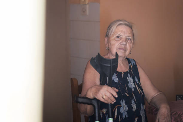Portrait of an old wrinkled hundred-year-old woman. A smiling grandmother wearing big glasses. Age, kindness and wisdom