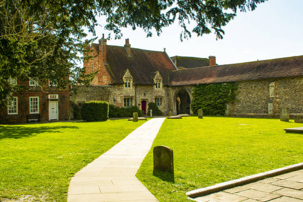 istock England, West sussex, Chichester Cathedral backyard with stone pathway. 2166346015