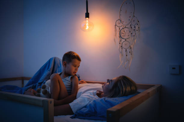 Mother and her son share a tender bedtime moment