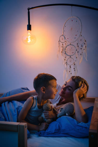 istock Mother and her son share a tender bedtime moment 2166350465