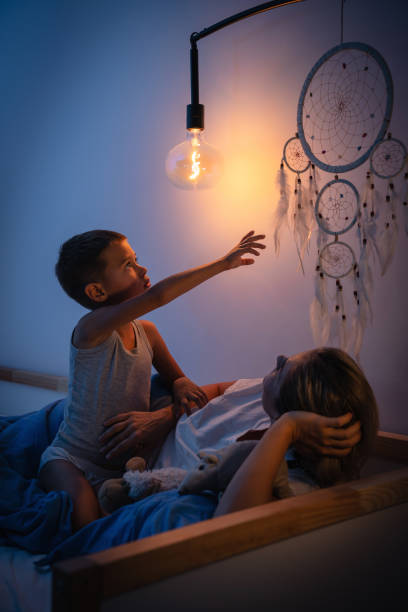 istock Mother and her son share a tender bedtime moment 2166350559