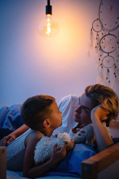 istock Mother and her son share a tender bedtime moment 2166350588