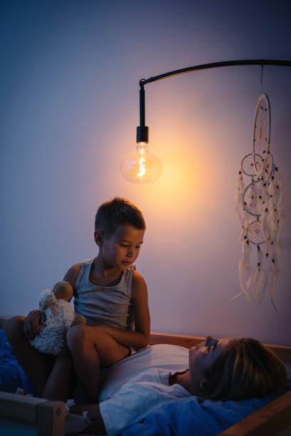 istock Mother and her son share a tender bedtime moment 2166350615