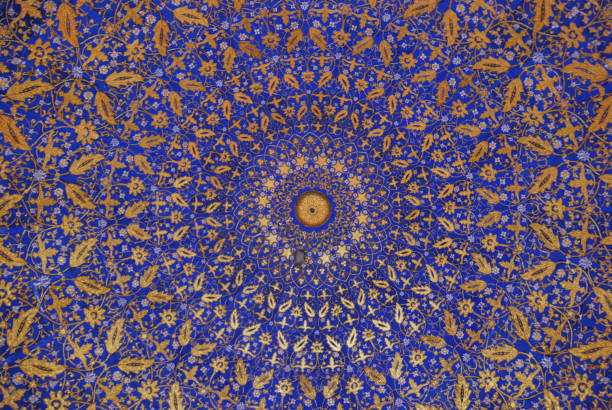 Ornate Uzbek mosque ceiling with intricate geometric patterns and vibrant colors. Perfect for cultural, architectural, and historical content. This photo has been taken in Samarkand registan square.
