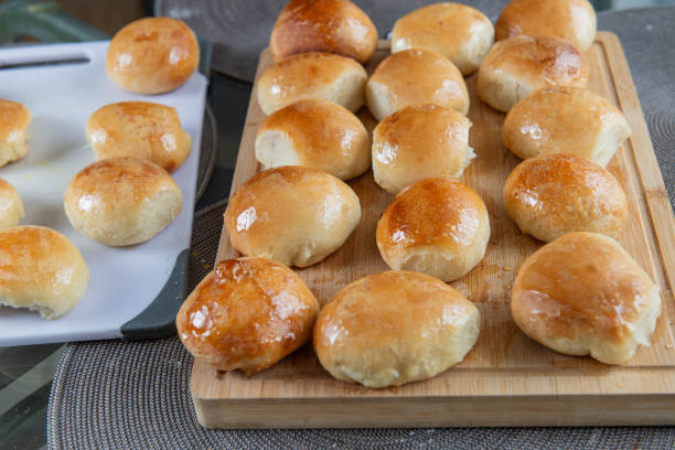 istock Freshly baked burger buns close up. Freshly baked buns home baking. Handmade. 2166354842