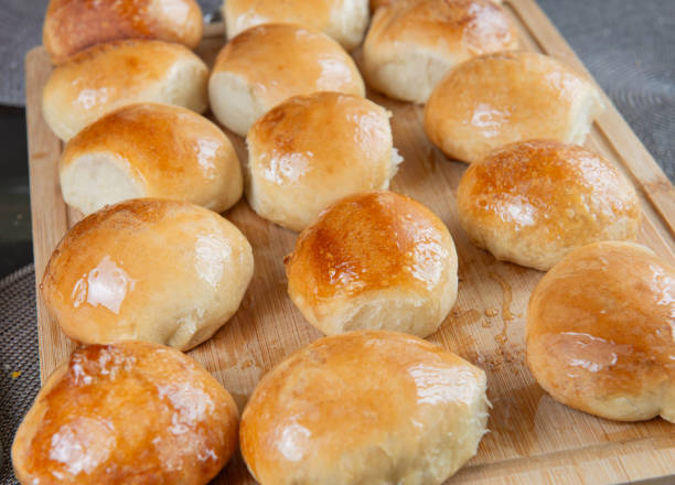 istock Freshly baked burger buns close up. Freshly baked buns home baking. Handmade. 2166354845