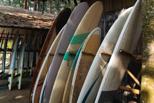 istock Row of colorful surfboards in authentic surf camp 2166357397