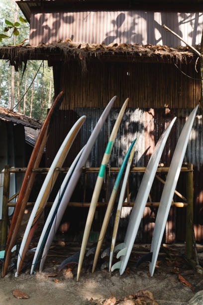 istock Row of colorful surfboards in authentic surf camp 2166358028