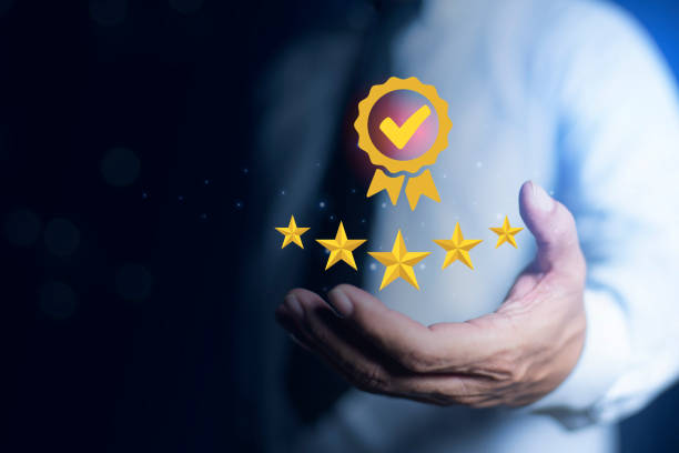 istock Businessman presses satisfaction icon on virtual screen. good service, premium, five stars, premium service assurance, excellence service, high quality, business excellence. Quality Assurance Concept. 2166359050