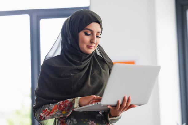 istock Female business professional using laptop 2166359951