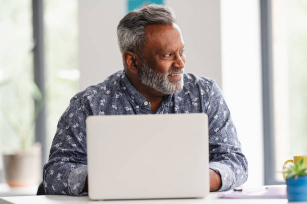 istock Male business professional using laptop 2166360086