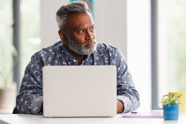 istock Male business professional using laptop 2166360099