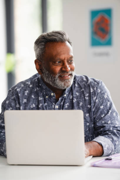 istock Male business professional using laptop 2166360199