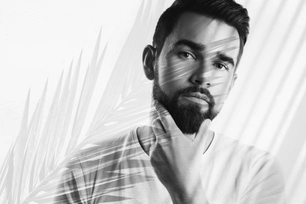 istock Handsome Bearded Man with Tropical Leaves Double Exposure Effect 2166361420