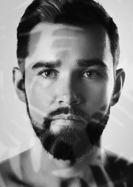 Handsome Bearded Man with Tropical Leaves Double Exposure Effect.