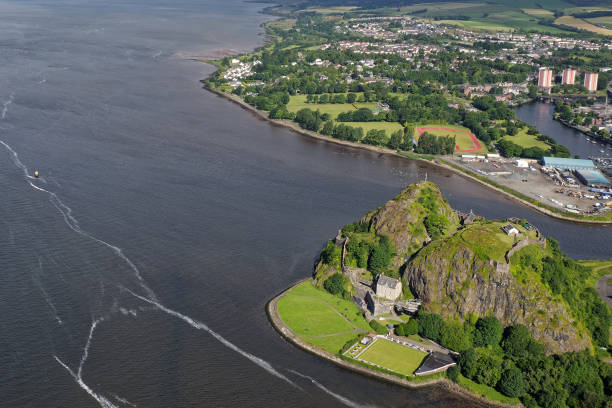 Dumbarton castle building on volcanic rock aerial view from above Scotland Dumbarton castle building on volcanic rock aerial view from above Scotland UK dumbarton castle stock pictures, royalty-free photos & images
