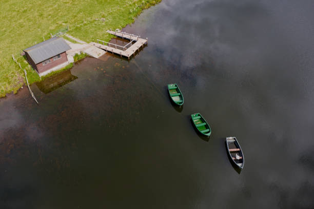 Fishing boats on Knapps Loch in Kilmacolm UK
