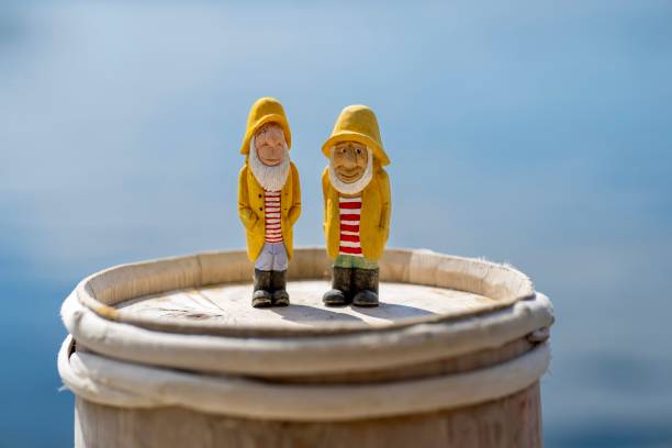 Two wooden fishing men