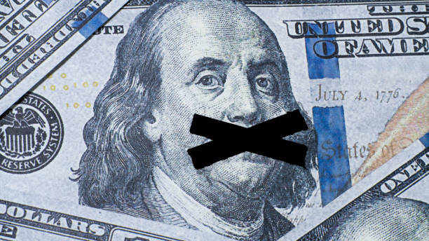 istock Taped mouth of Benjamin Franklin on a banknote 2166365945