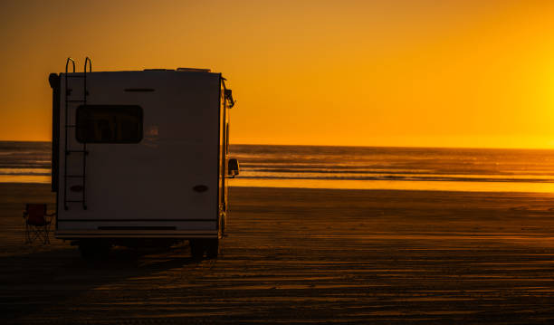 istock Relaxing Evening at the Beach With an RV Under a Vibrant Sunset 2166370790