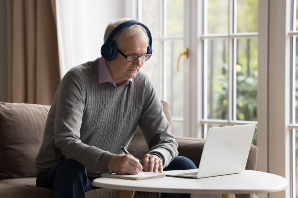 istock Focused senior man use notebook for online studying at home 2166372224