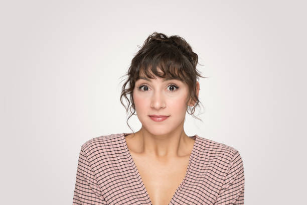 istock A young beautiful woman showing emotions front view studio photo shoot 2166372499