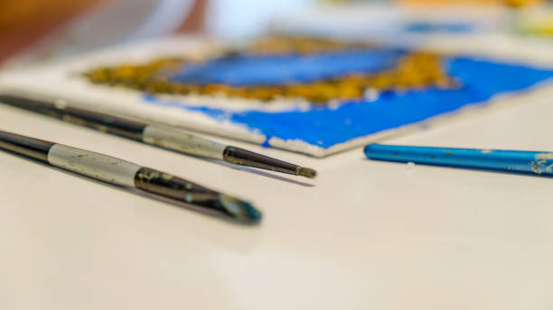 istock Close-up view of paintbrushes in an art studio 2166380275
