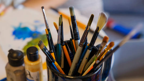 istock Close-up view of paintbrushes in an art studio 2166380294