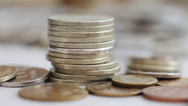 istock A column of old white coins in close-up. 2166382290