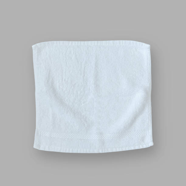 istock White cotton towel mock up template square size fabric wiper isolated on grey background with clipping path, flat lay top view for hand towel and face cloths mockup template 2166382489
