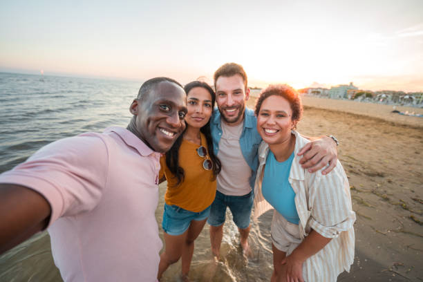 istock Multi-Ethnic Friends Enjoying the Sandy Beach 2166383495