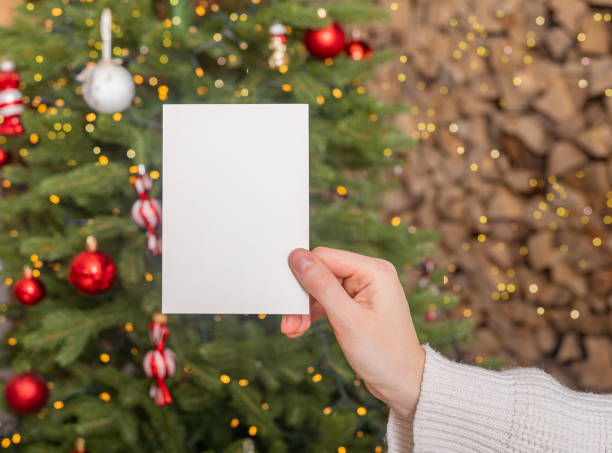istock Gift certificate mockup, postcard mock up on Christmas in hand 2166385855