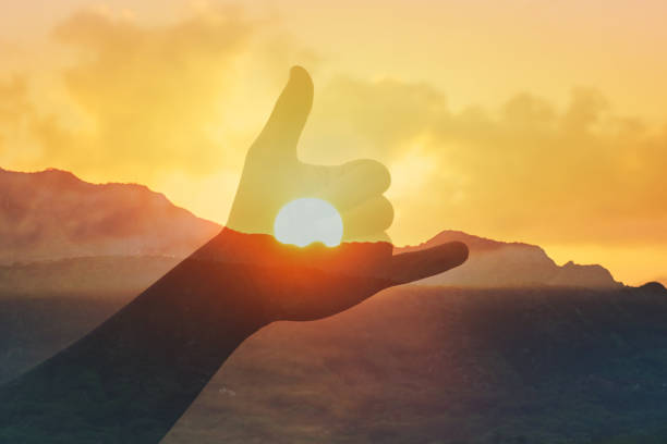 istock Man showing Shaka against sunset background. 2166389731