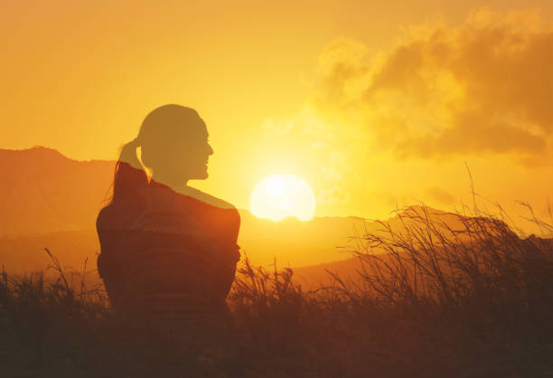 istock Woman at sunset. 2166389750