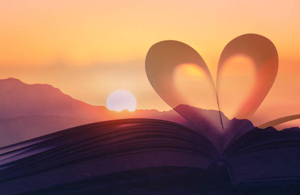 istock Open book and beautiful sunrise background, religious belief, knowledge and love. 2166389774