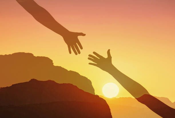 istock Lending a helping hand, teamwork friendship and support concept 2166389817
